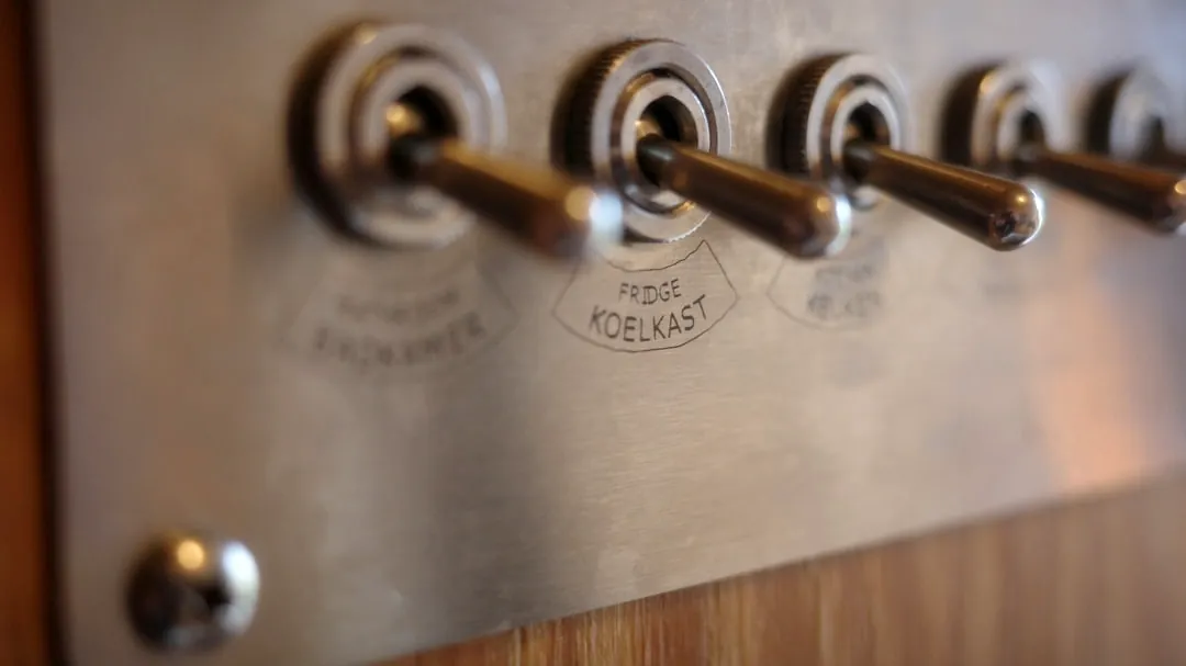 Row of vintage metal toggle light switches