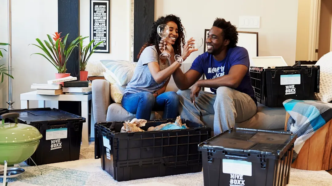 man and woman sitting on couch